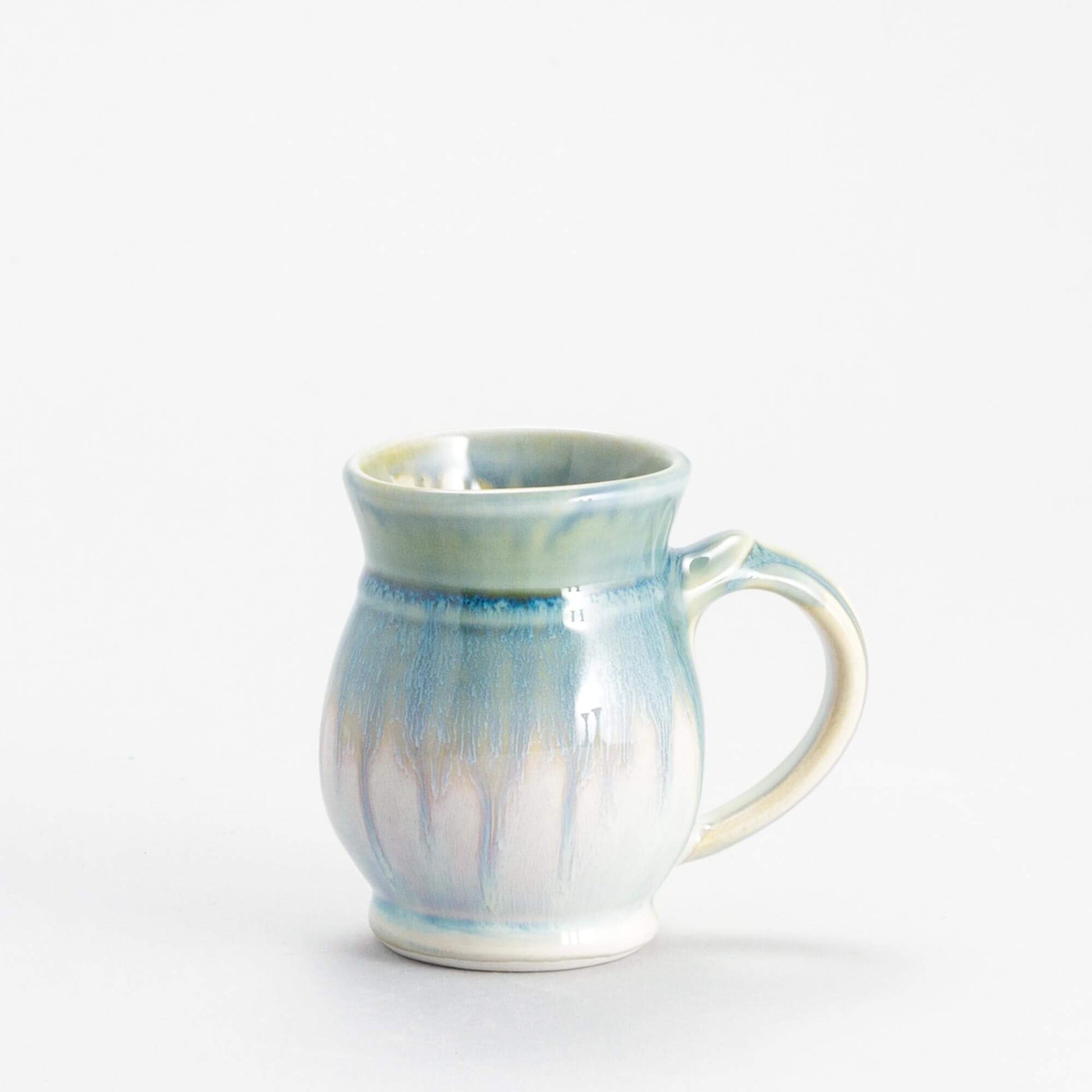 Handmade Pottery Curvy Mug made by Olyssia Designs LLC in US Ivory & Blue Oribe