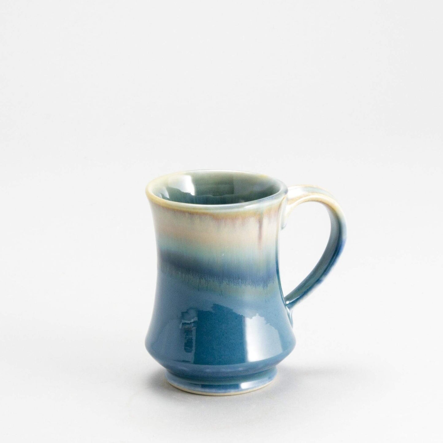 Handmade Pottery Pedestal Mug made by Olyssia Designs LLC in US Blue Oribe