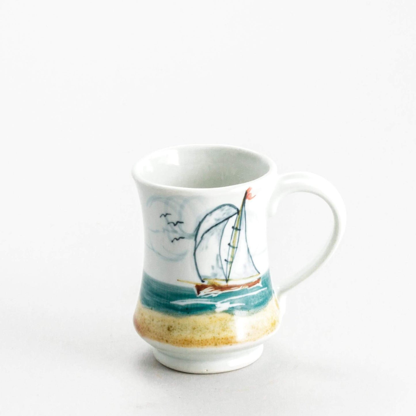 Handmade Pottery Pedestal Mug made by Olyssia Designs LLC in US Sailboat
