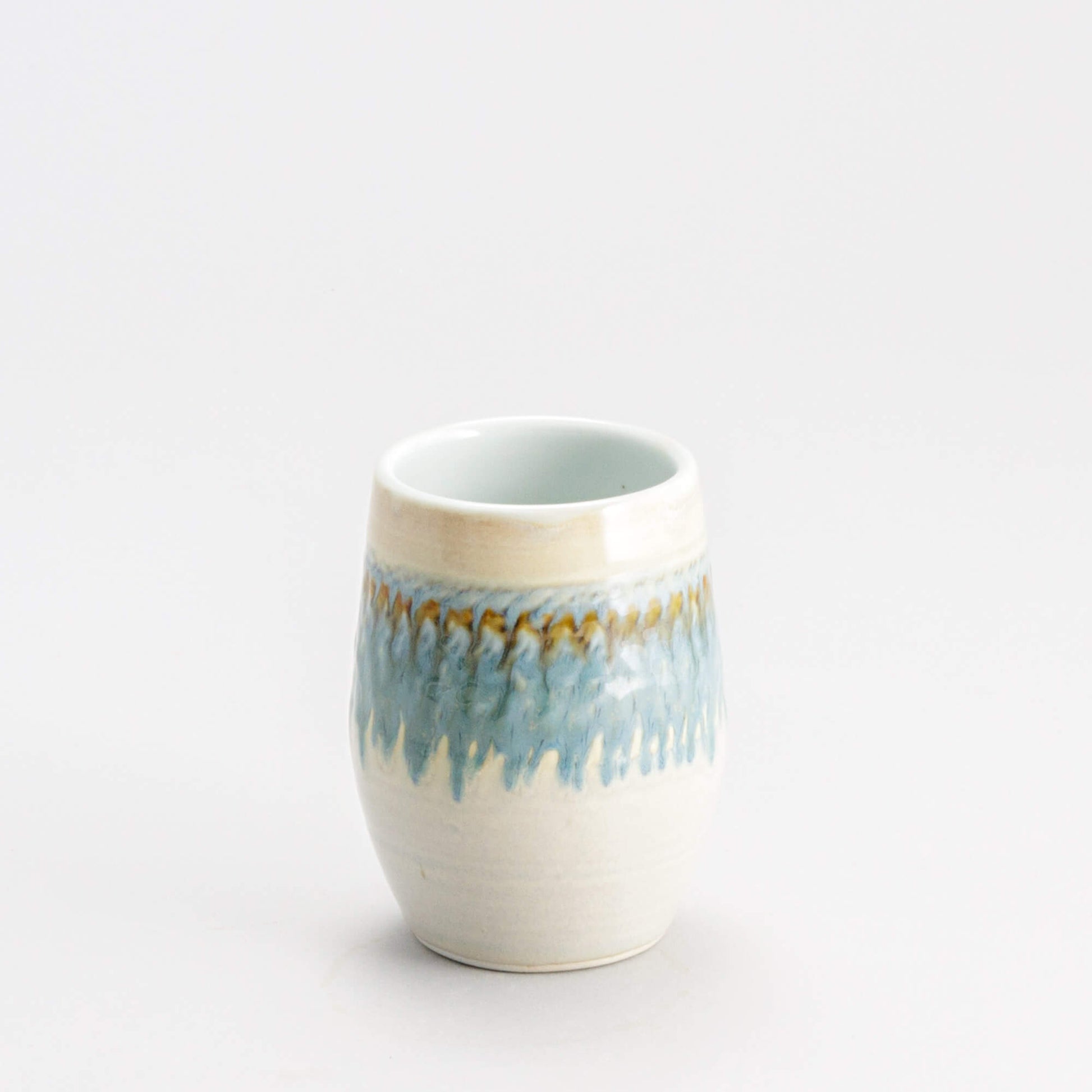 Handmade Pottery Stemless Wine Tumbler made by Olyssia Designs LLC  in US Ivory & Blue Oribe