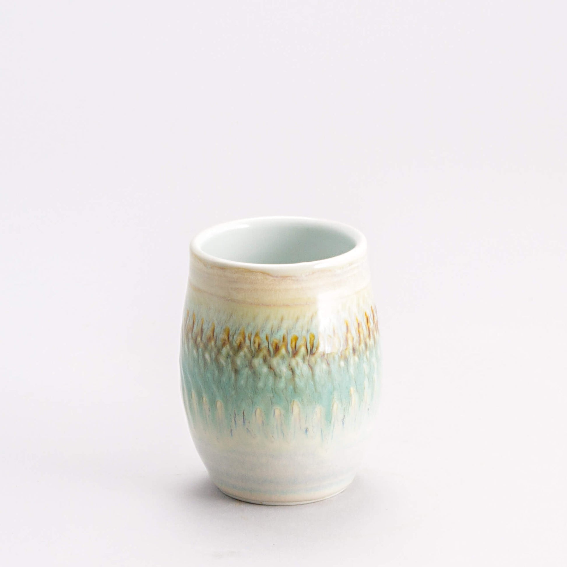Handmade Pottery Stemless Wine Tumbler made by Olyssia Designs LLC  in US Ivory & Green Oribe
