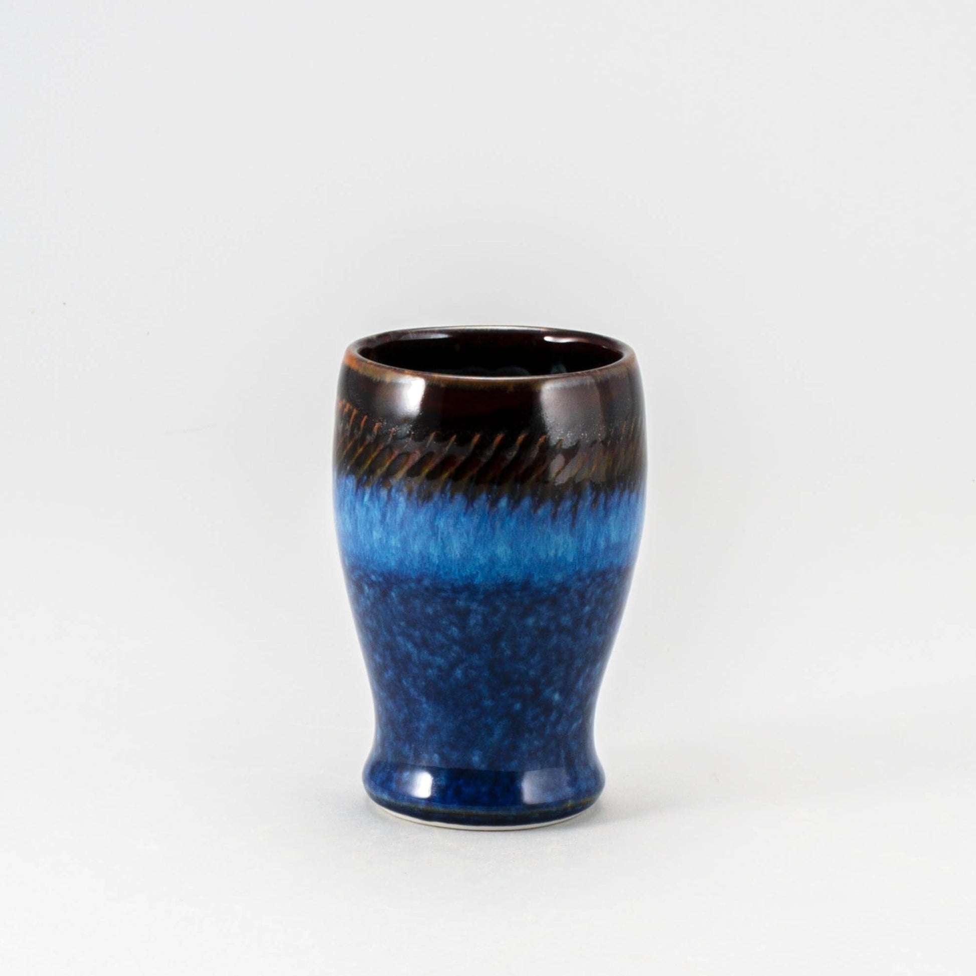 Handmade Pottery Curvy Tumbler in Blue Hamada pattern made by Olyssia Designs LLC in US