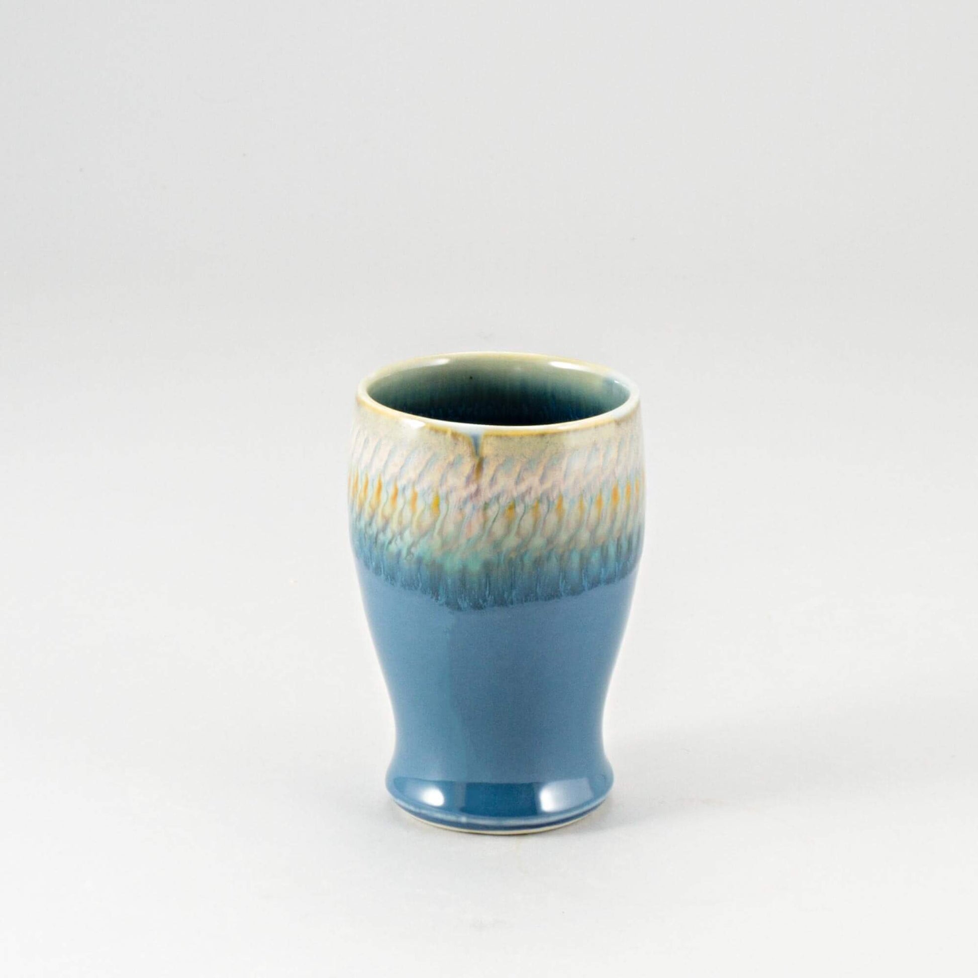 Handmade Pottery Curvy Tumbler in Blue Oribe pattern made by Olyssia Designs LLC in US